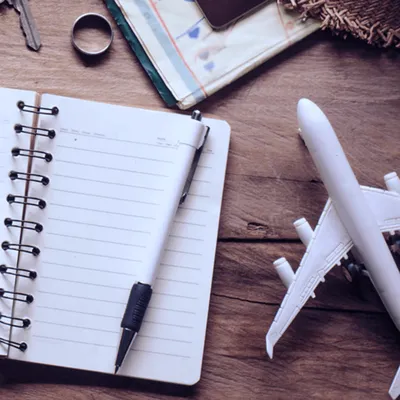 Model Plane Next To Notepad