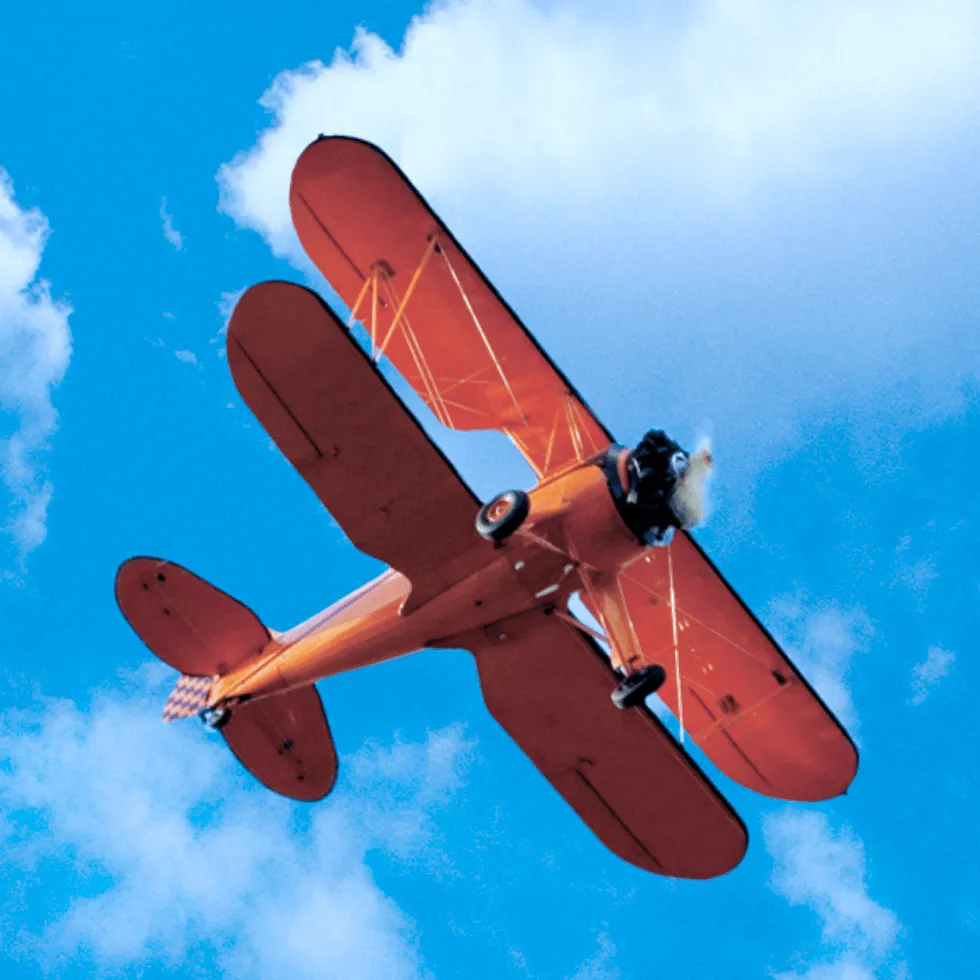 Orange Aircraft In Sky