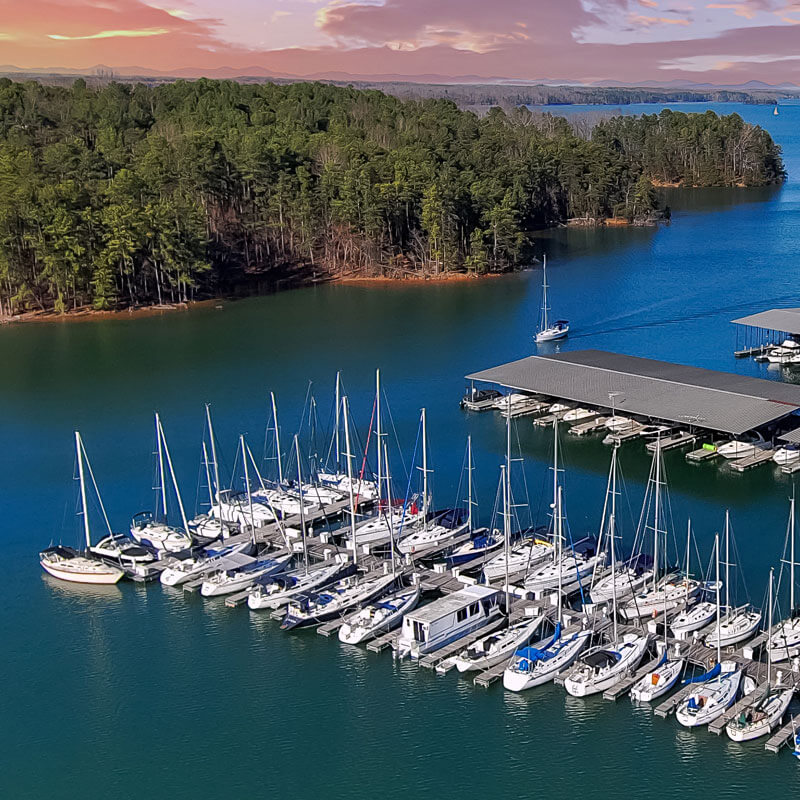 A scenic shot of Lake Lanier with a boat. Alt Text: Boat on Lake Lanier, representing recreational insurance services for Buford residents.
